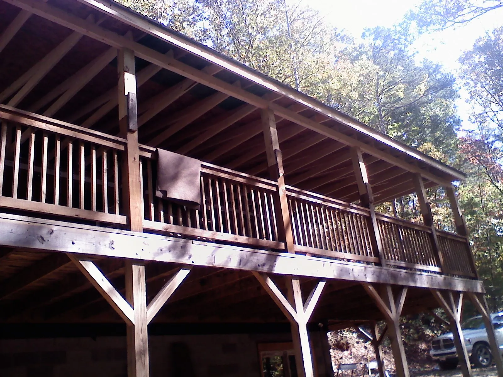 Timber framing under a new elevated porch and deck — Roof Leak Repair in Two Rivers by Roofing Brothers